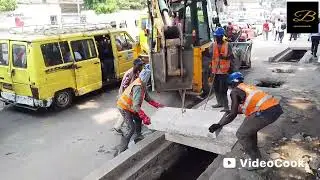 Kinshasa Gombe, après curage pose des nouvelles dallette sur le caniveau, kin Ezo bonga