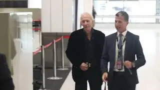 Paul hogan departs Australia