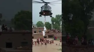Army Helicopter Drops Food During in Heavy Floods