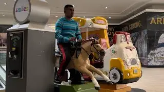Me riding Sundance horse kiddie ride (eletech refurb)