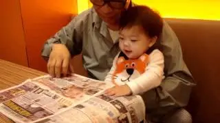 Reading newspaper with Grandpa
