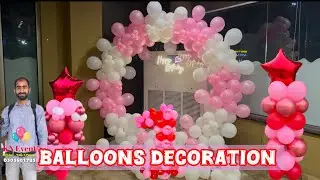 Birthday balloons decoration at home in white and pink colour 