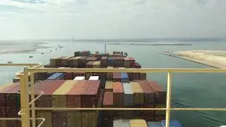 Neo Panamax container ship crossing Lake Timsah as part of passing the Suez Canal.