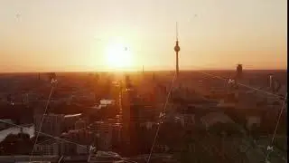 AERIAL: Flight over Berlin, Germany at beautiful Sunset, Sunlight and view on Alexanderplatz TV