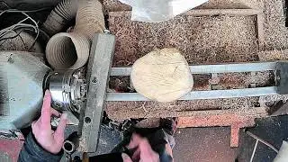 Holding the wood before creating a tenon. #woodturning by Chris Fisher.