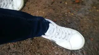Walking on wet crunchy sand and stones after rain