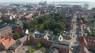 Birds eye of Esbjerg, Denmark, with building made of brick. Look up revealing the harbor, one of the