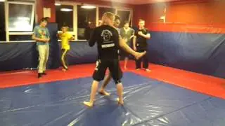 Deflecting a big knee strike - John Scanlon