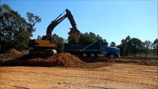 Volvo 160C Excavator Loading Clay