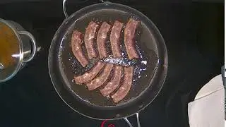 Cooking bacon and sausages and eggs timelapse