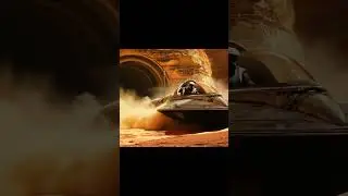 a hovercraft rises and moves off camera, dust blows everywhere