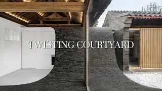 Chinese Courtyard House Designed with Curved Walls and Brick Floors