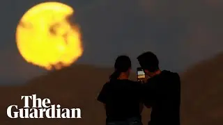 Supermoon with partial lunar eclipse charms stargazers across the world