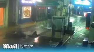 Horrifying moment e-bike slams into pedestrian before riders take off