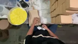 how  to fold  the sides of a small cardboard box and make  a make a boxand placing it on a stack