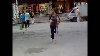 Asian Amputee Woman- One Legged Asian Amputee Girl Walking With One Crutch In The Street
