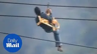 That's one way to get to work! Villagers commute via zip line