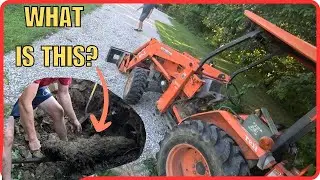 CLEARING A CLOGGED CULVERT PIPE UNDER A DRIVEWAY