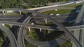 Multi-Level Road Interchange and Cars Traffic at Sunny Day Aerial View | Stock Footage - Videohive