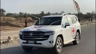 Red Cross convoy travels in Gaza, believed to be on way to pick up the first Israeli hostages
