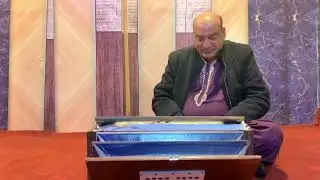 Shud Kalyan playing on harmonium with peacefully 
