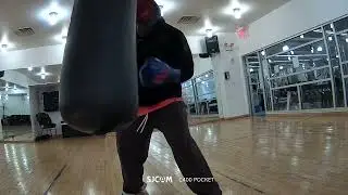 Boxing Training: Working on a Punching Bag. Practice a combination of punches. enjoy the moment.