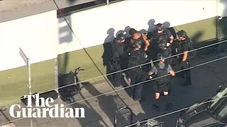 Moment LA shooter surrenders himself to police