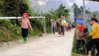 Single mother participates in community service in the village where she lives.