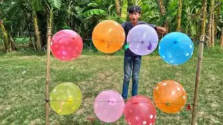 , flower balloon pop , big balloons  , outdoor flower balloon pop