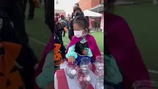 Kid beats high score & wins massive candy prize! 🍭