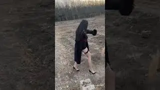 An Asian woman in heels walks across a field #asmr