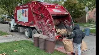 Red Priority Waste McNeilus Rear Loader Garbage Truck Packing Heavy Livonia Fall Yardwaste