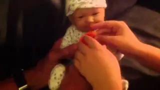 Baby doll Valerie eats a hotdog