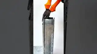 Fitting diagonal metal tube into slotted vertical pipe