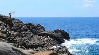 A flag on the rocks