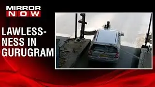 Toll tax employee dragged on bonnet of car in Gurugram, Police arrest two accused | Caught On Camera