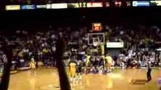 Lawrence McKenzie hits a 3 over Michigan