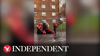 Londoners ferried across flooded road in lifeboat after water pipe burst