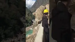 The process of cleaning up rockfall in the middle of the road