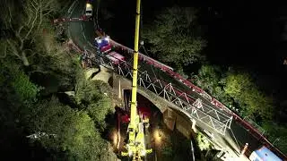 Complex operation using road-rail crane to remove footbridge for refurbishment