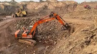 Excavator break a mountain | powerful heavy equipment machine in action drilling and humaring
