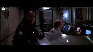 Scene from Die Hard with ND vs USC game on in the background 1/2