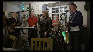 Samantha sings There’s a Guy Works Down the Chip Shop Swears He’s Elvis