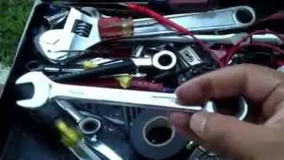 Essential travel toolbox for emergency car repairs and preparedness.