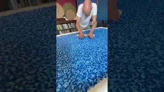 Rolling the dots. Evening out the surface before applying the next layer of dots.