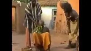 African Voodoo Witchdoctor Treats Man for Migraine