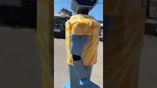 Guy harassing a clanker at the fair