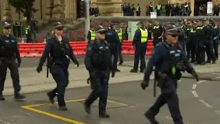 Police show of force as they brace for opposing rallies to gather in Melbourne's CBD