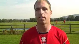 Cheltenham Town defender Keith Lowe talks to Jon Palmer