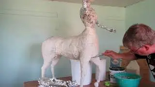 Applying home made paper clay to my centaur sculpture armature